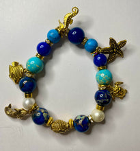 Load image into Gallery viewer, Exotic Turquoise, Blue Jasper and Blue Agate Gemstone Stretch Bracelet with Gold Filled Marine Charms
